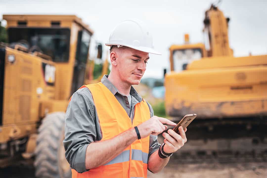 Construction worker on mobile phone