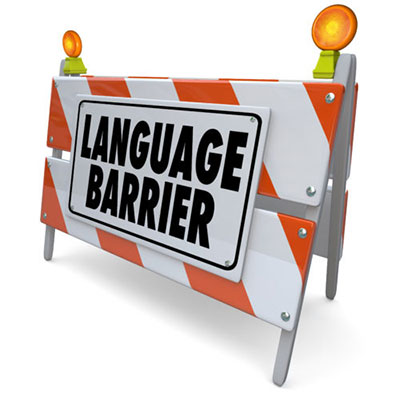 Conceptual image of a construction barricade with a sign saying "language barrier"